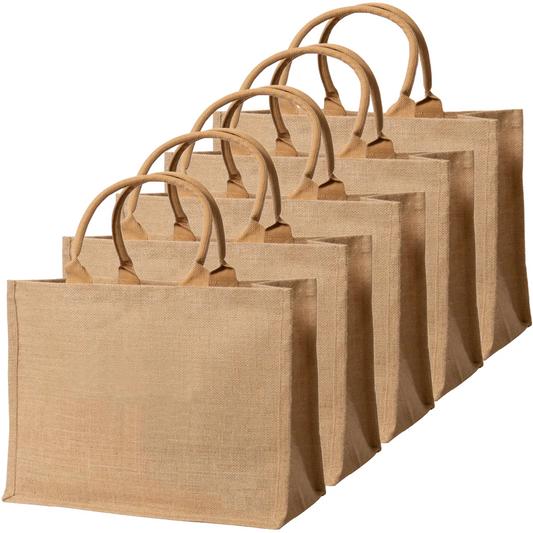 Set of brown jute bags of different sizes on a white background